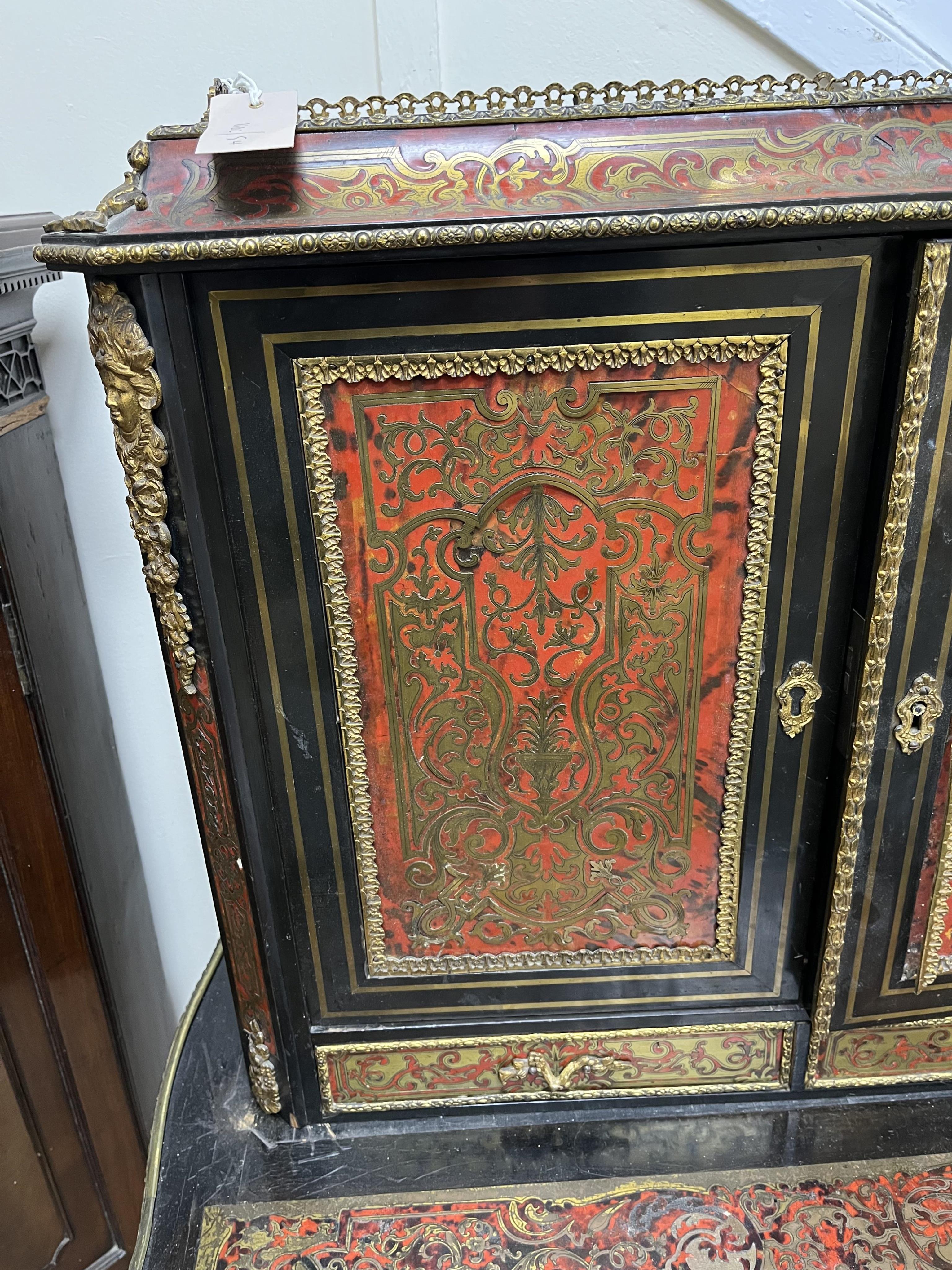 A 19th century French ebonised boulle bonheur du jour, width 75cm, depth 49cm, height 129cm. Condition - poor to fair